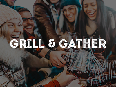 A bunch of friends in winter gear toasting with wine glasses.